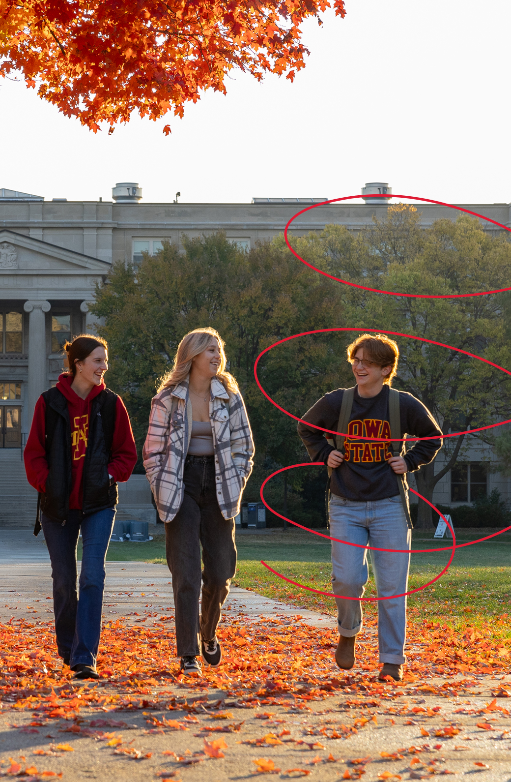 Students walking to class on a fall day.