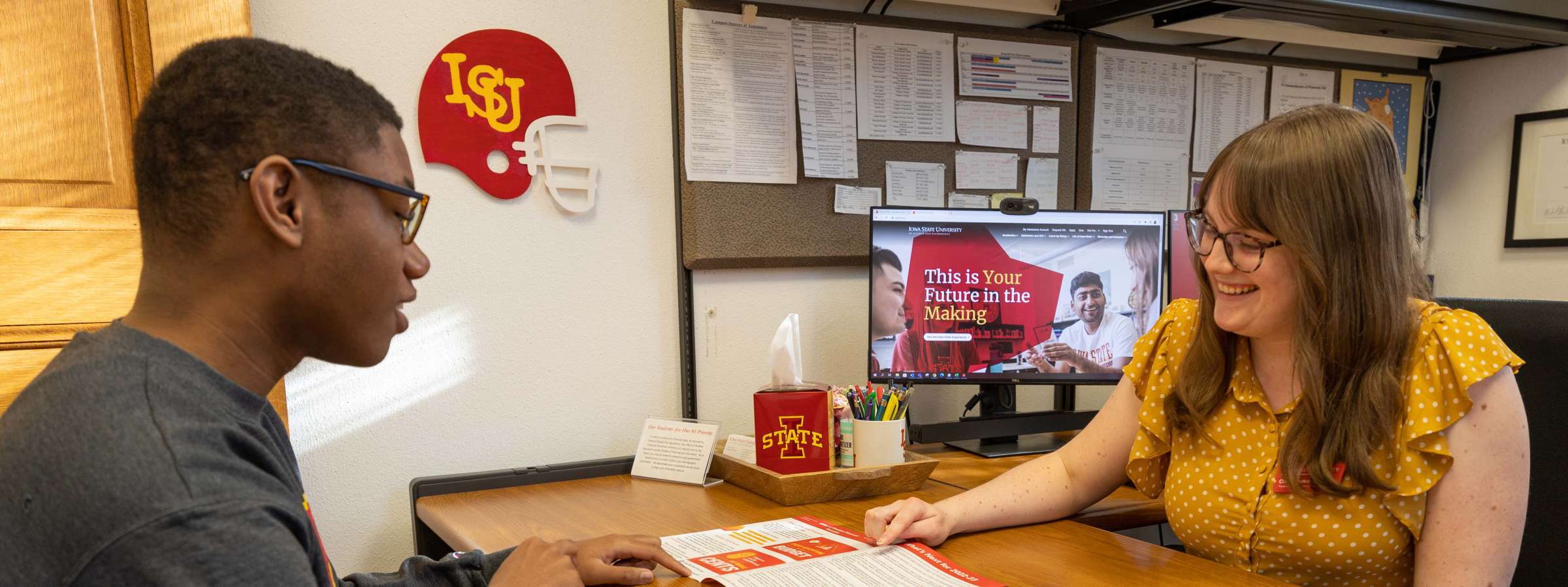 A student meets with a staff member from financial aid.