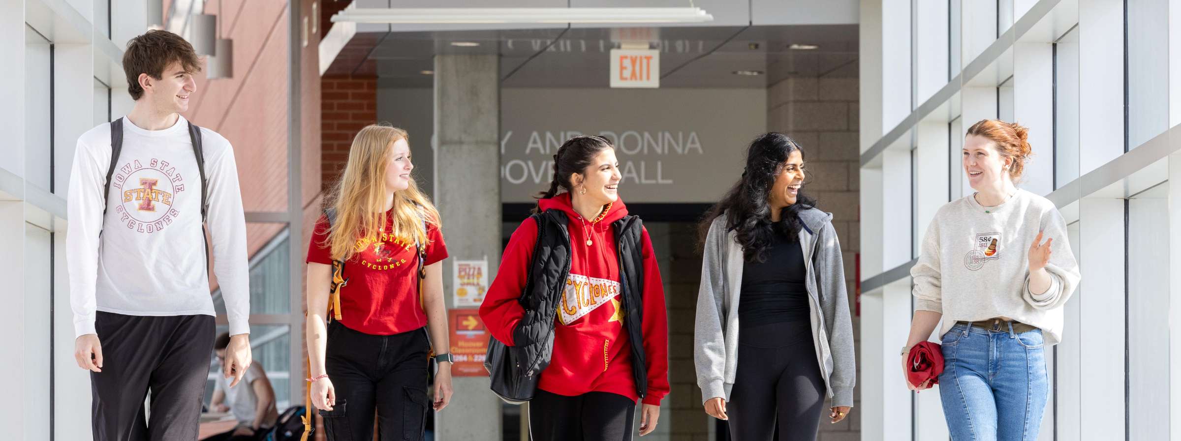 Five students walking in the Hoover skywalk